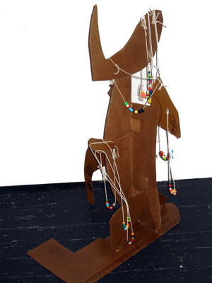 Pete Corrie, Untitled (statue) (2007), wood, newspaper, paint, string, beads , 22 x 10 x 9, $1,500