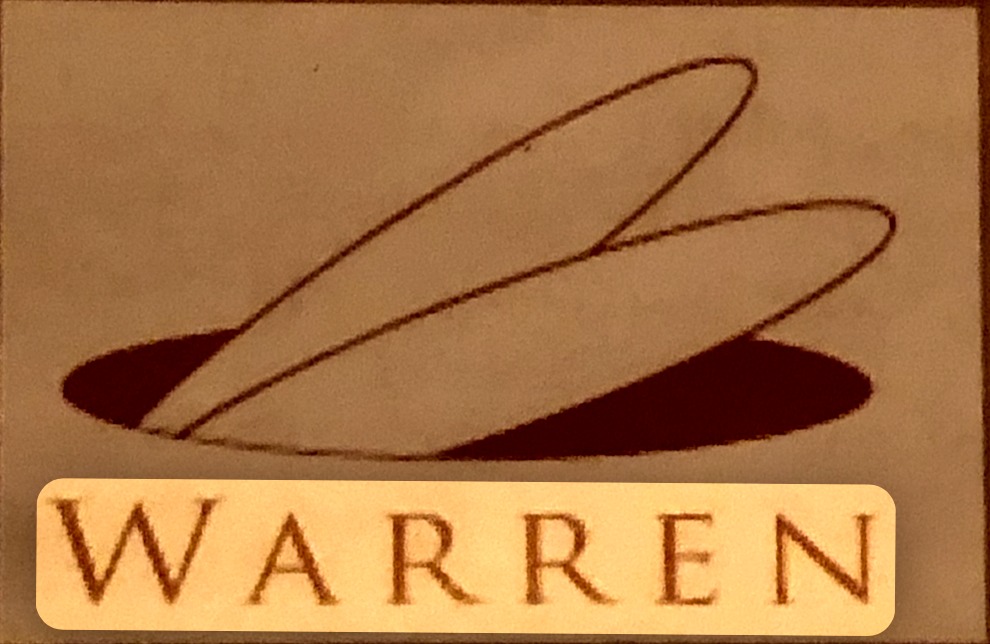 logo card / sign: WARREN — rabbit ears disappearing into a hole