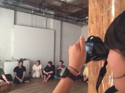 Performers seated on the floor, 25 July 2016.