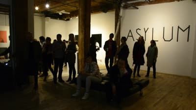 The crowd by the ASYLUM title wall, 13 April 2016.