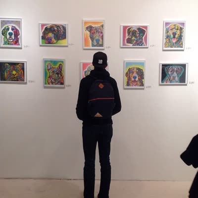 Dog portraits by Dean Russo on the gallery wall, 3 April 2014.