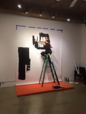 Gilf painting the mural, 20 November 2015.