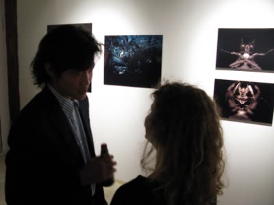 Opening reception, visitors with photographs by Margaret Inga Wiatrowski and Lindsay Comstock, 25 September 2009.