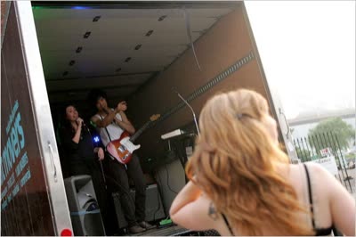 The first Art Attack, August 2009: Color War (Lindsay Mound and Justin William Lin) in the back of a Rabbit Movers truck, with Erica Harmon watching. Photo: Jessica Ebelhar / The New York Times.