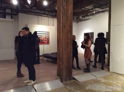 Visitors among the photographs, 29 April 2016.