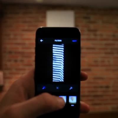 The same work seen on a phone screen, lit by the flash, April 2015.