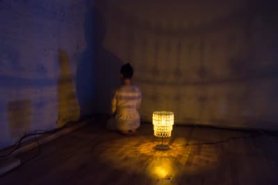 NEGATIVES: a performer kneeling by a lamp, 21 December 2015.