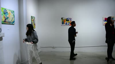 Visitors among the paintings, Prismatic Vision, 28 October 2015.
