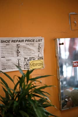 Lindsay Blatt, from Repair & Shine: shoe repair price list, 2008, large-format photograph.