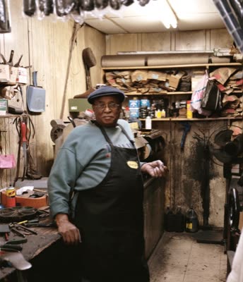 Lindsay Blatt, from Repair & Shine: shoe repairman in his shop, 2008, large-format photograph.