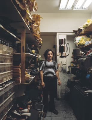 Lindsay Blatt, from Repair & Shine: shoe repairman in a narrow shop, 2008, large-format photograph.