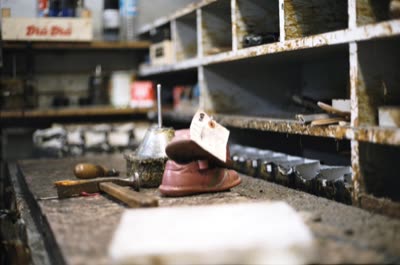 Lindsay Blatt, from Repair & Shine: shoe on the workbench, 2008, large-format photograph.