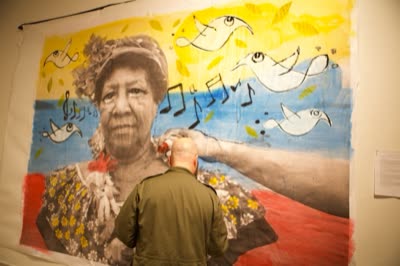 Live painting on a photographic portrait of a woman in a flowered headdress, 4 October 2015.
