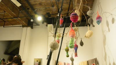 Crocheted forms hanging from branches, 20 April 2016.