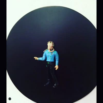 Art toy on a black disc, 21 July 2016.