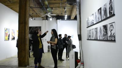 Black-and-white works by Lauro Samblás along the wall, 10 February 2016.