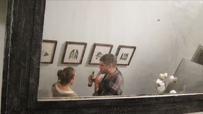 Opening reception, reflected in a mirror, 4 February 2010.