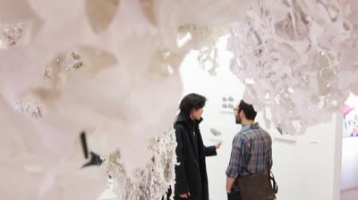 Opening reception, seen through Emily Nachison's installation, 4 February 2010.